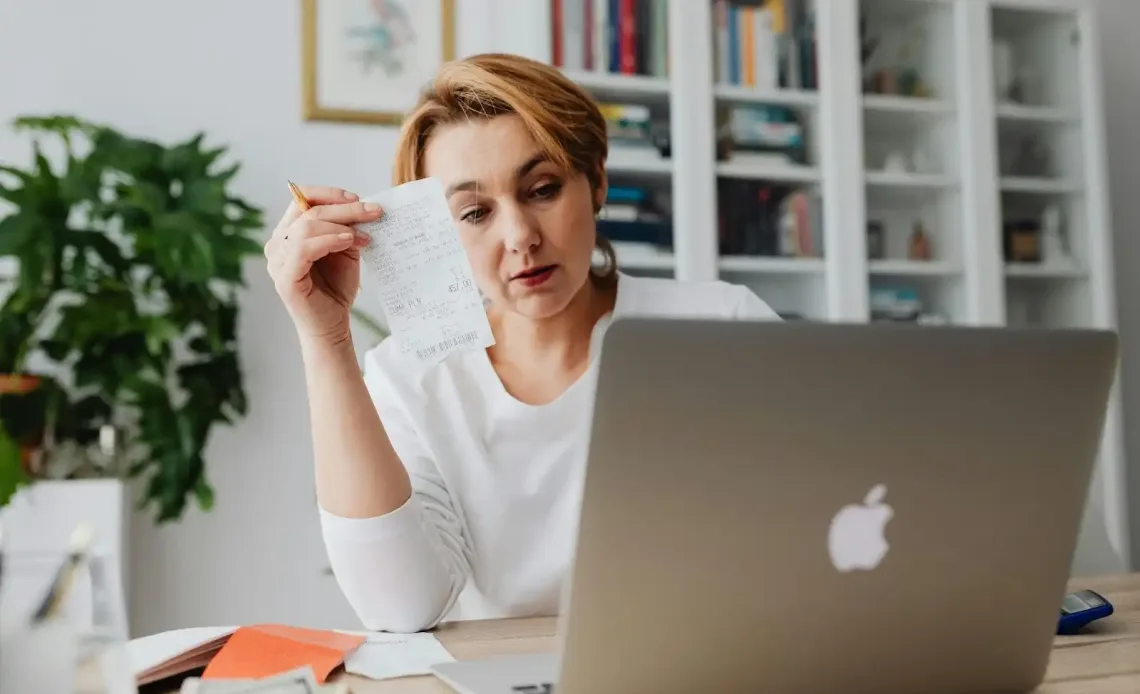 woman-calculating-her-receipts